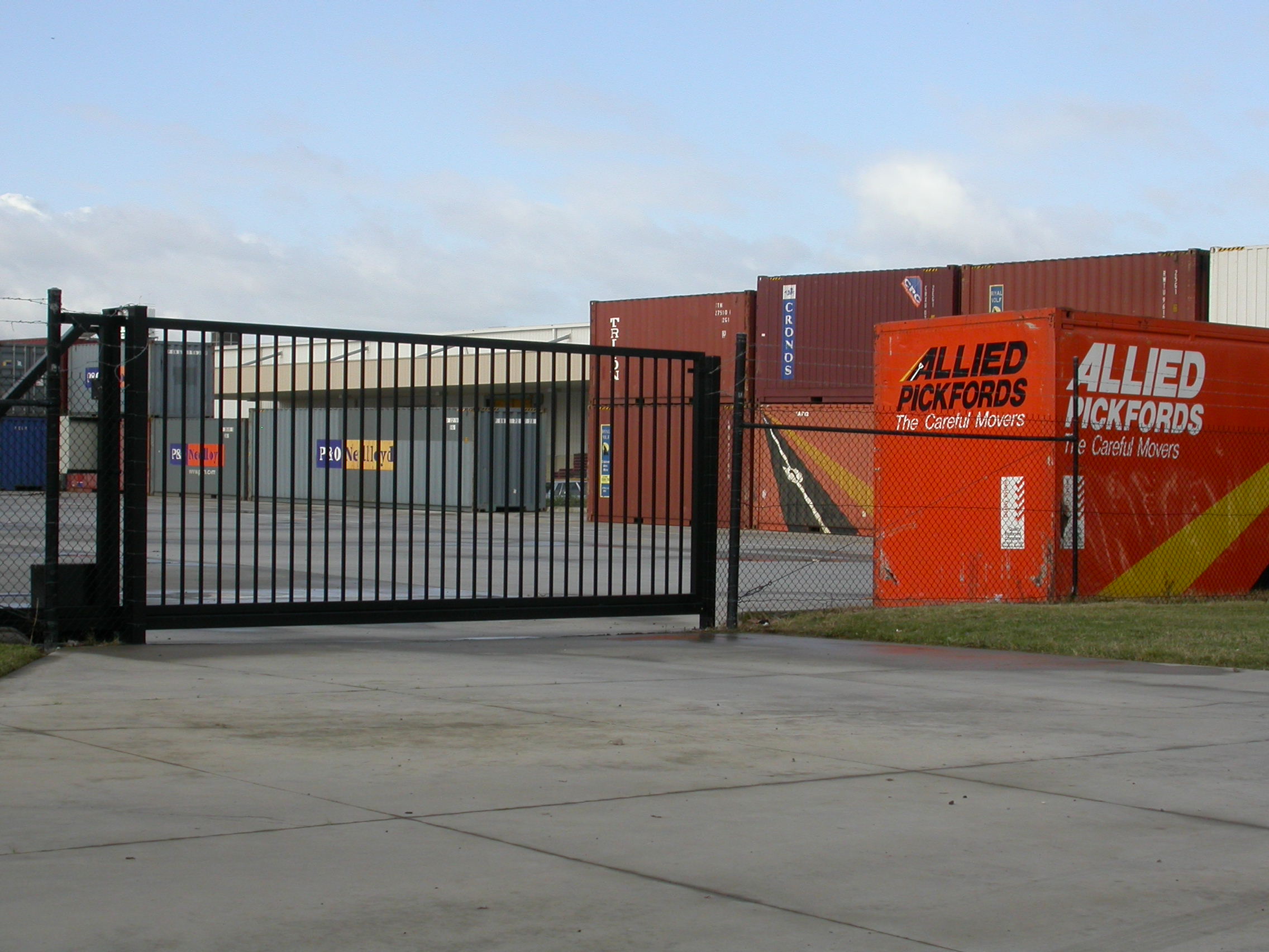 Industrial sliding gate and fence at freight yard