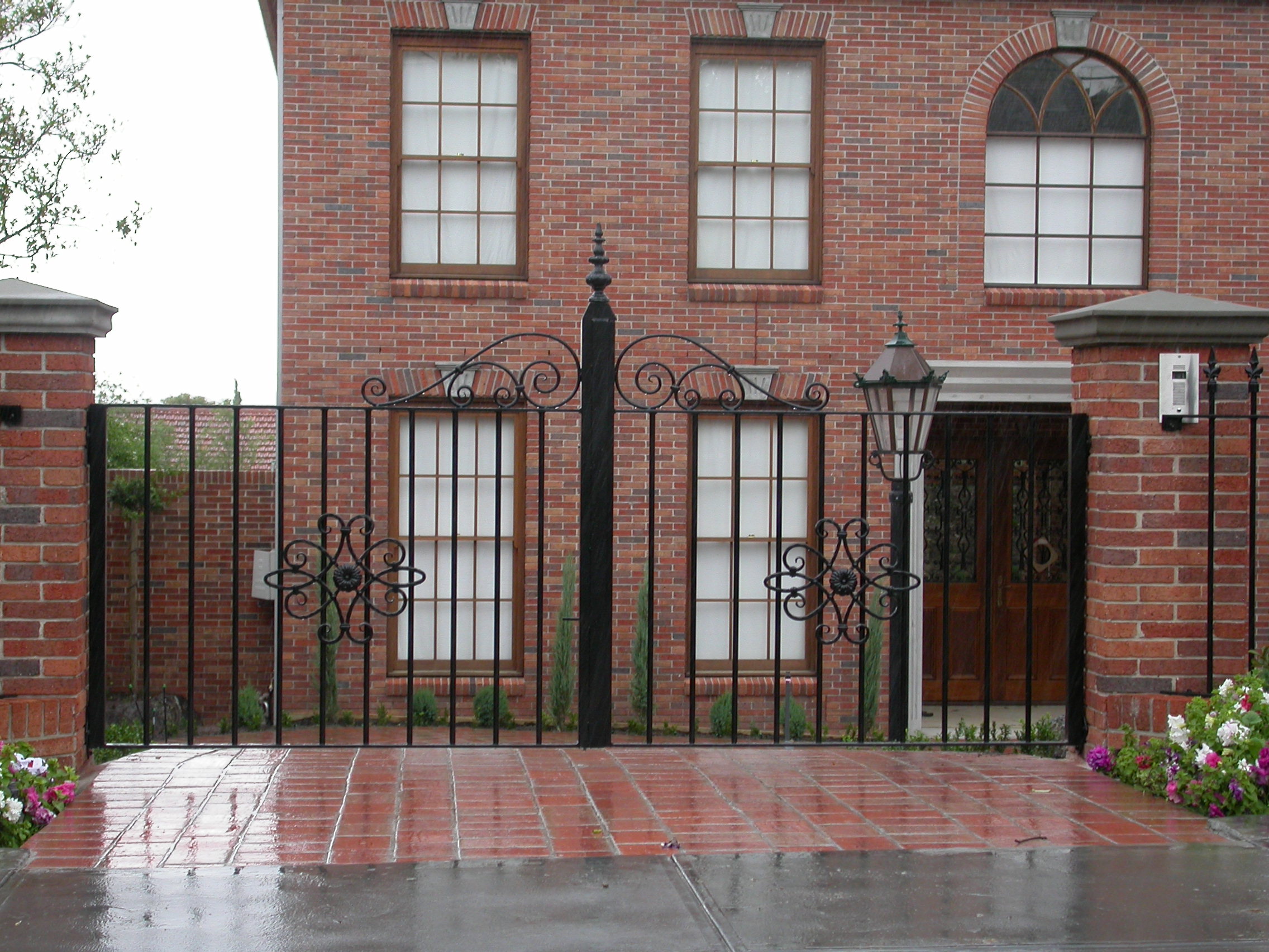Decorative fenced entrance with controlled access