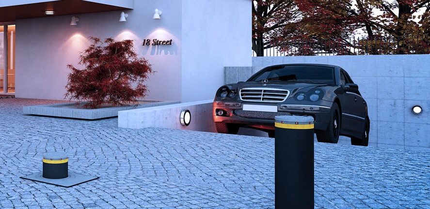 Retractable bollards installed in a driveway entry