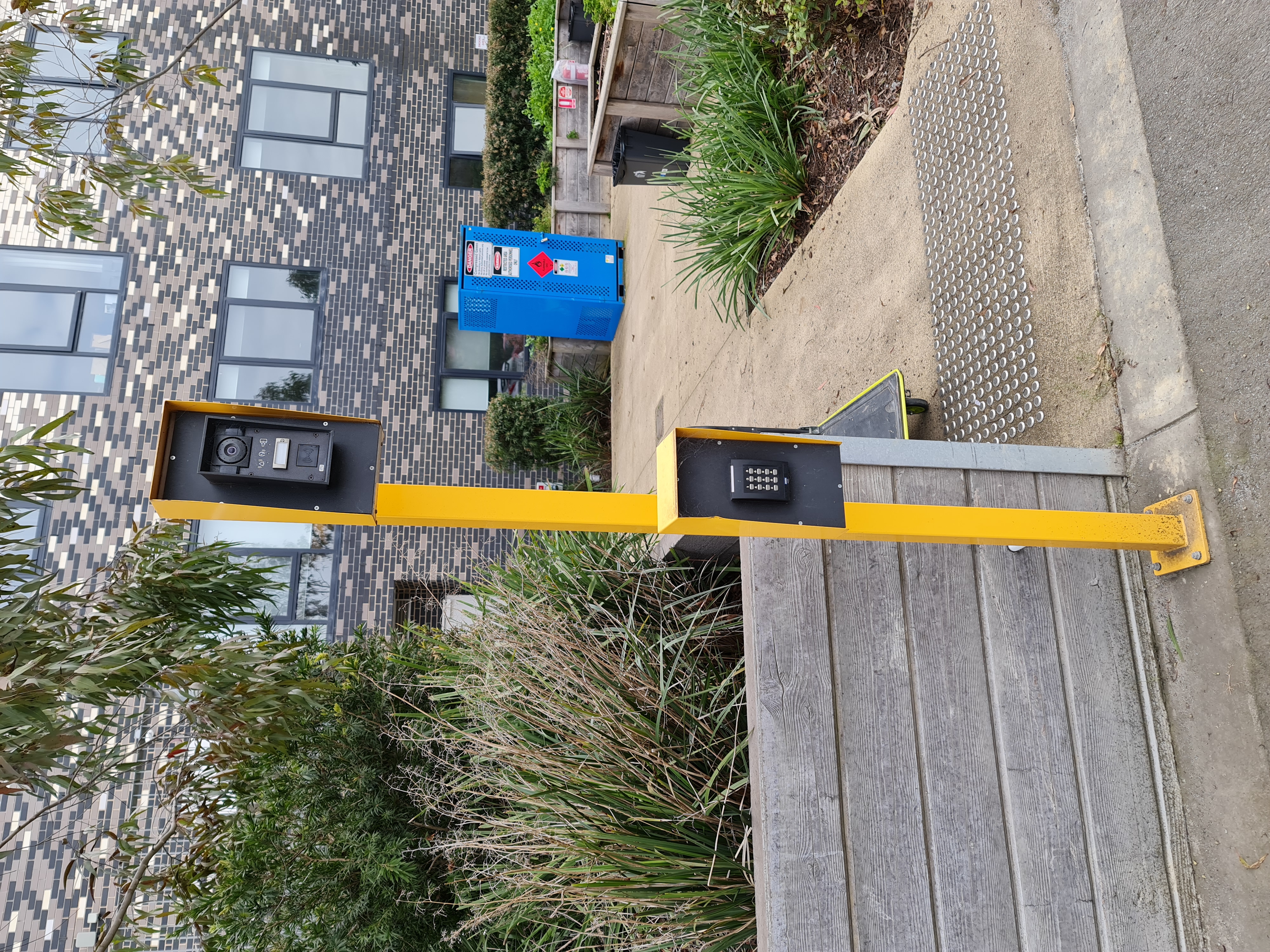 Access control hardware beside a gate