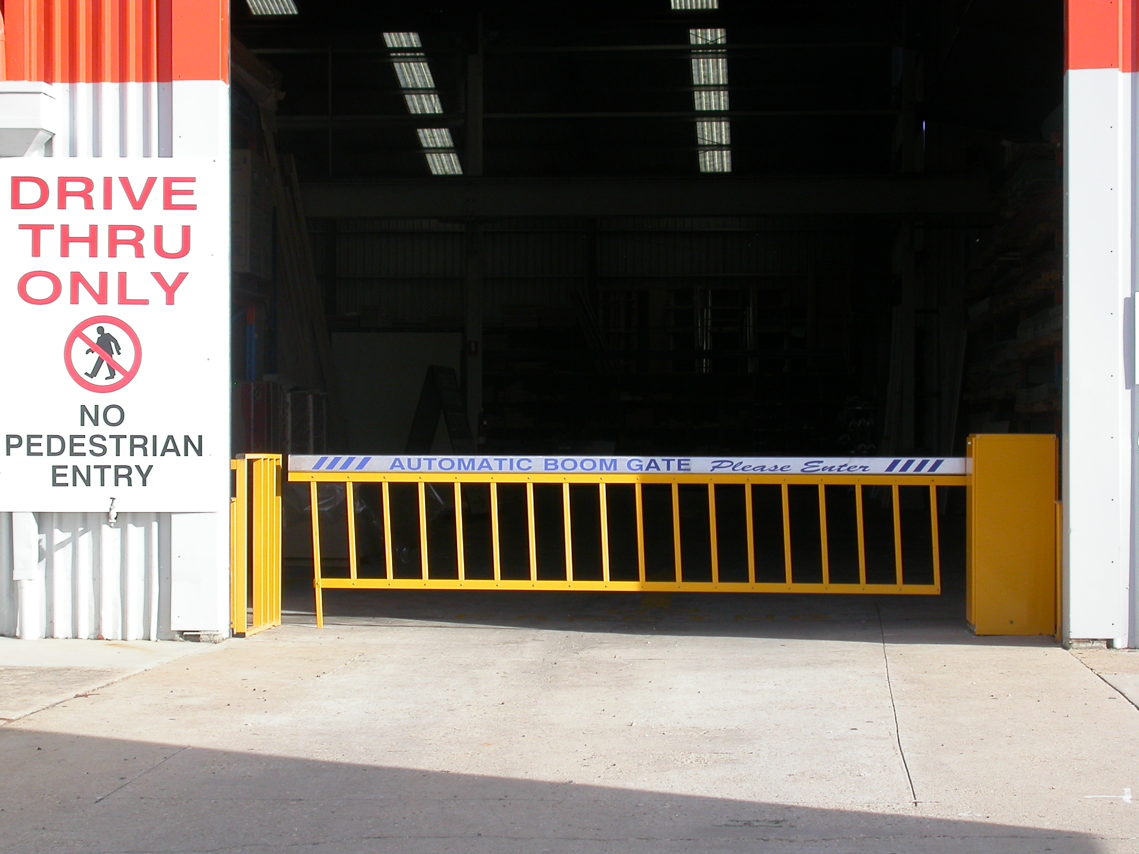 Commercial boom gate with rigid skirt barrier