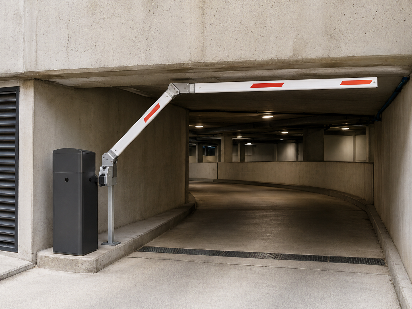 Articulated boom arm installed at a low-headroom parking entrance