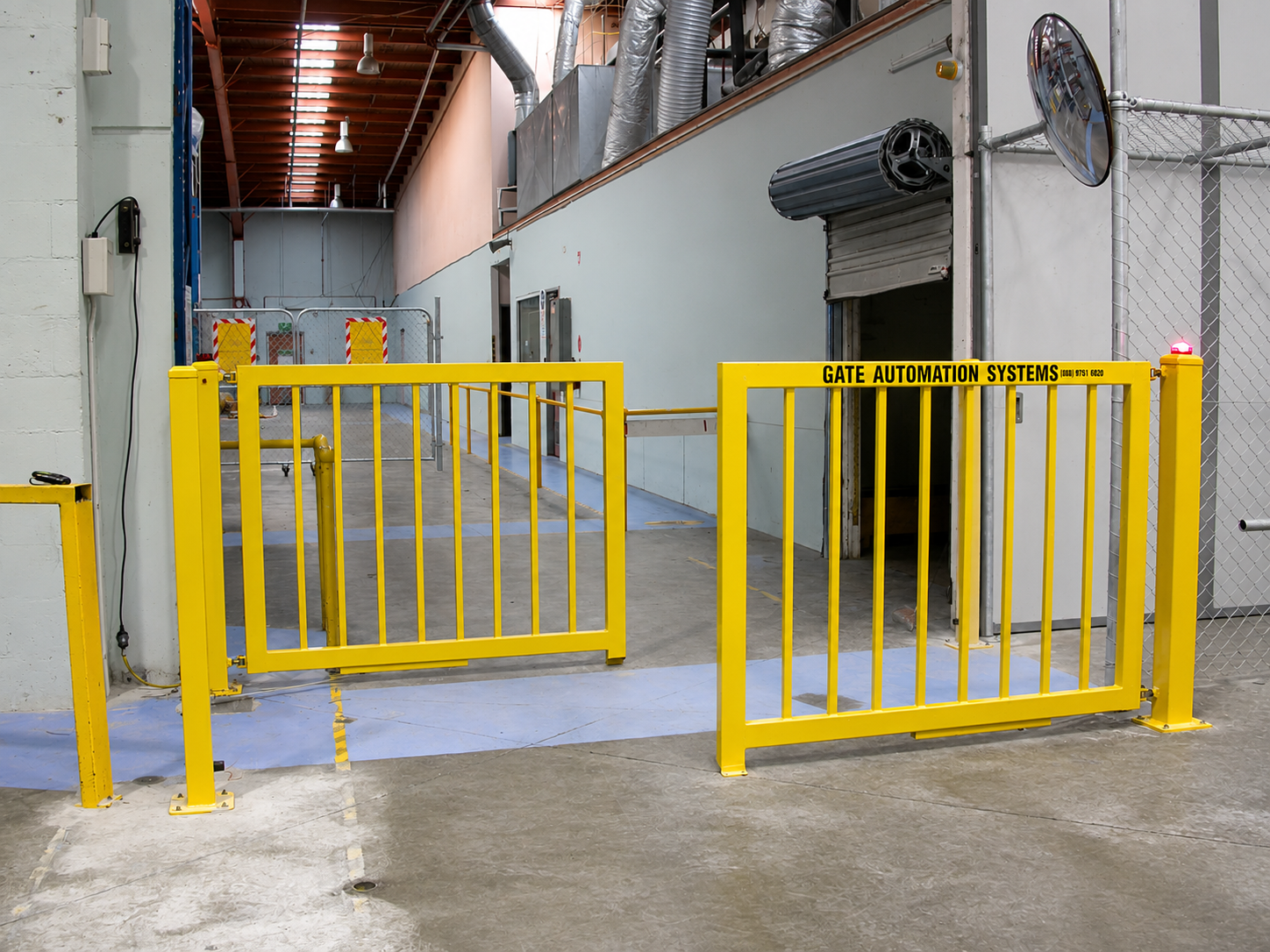 Industrial safety crossing separating pedestrian and forklift routes inside a warehouse