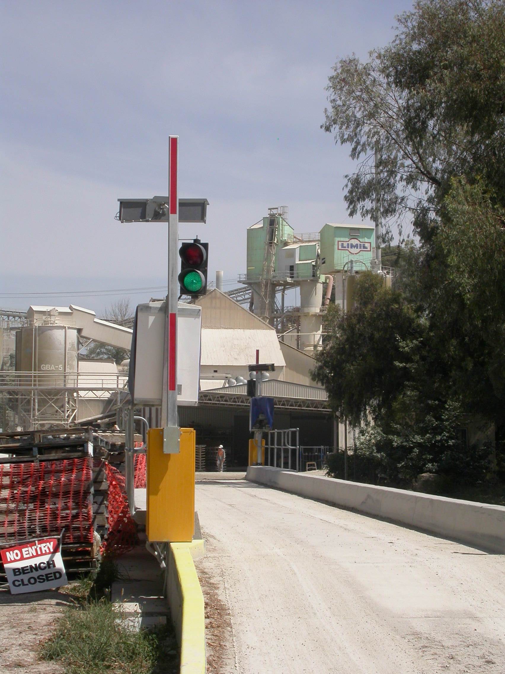 Controlled drive-through boom gate installation