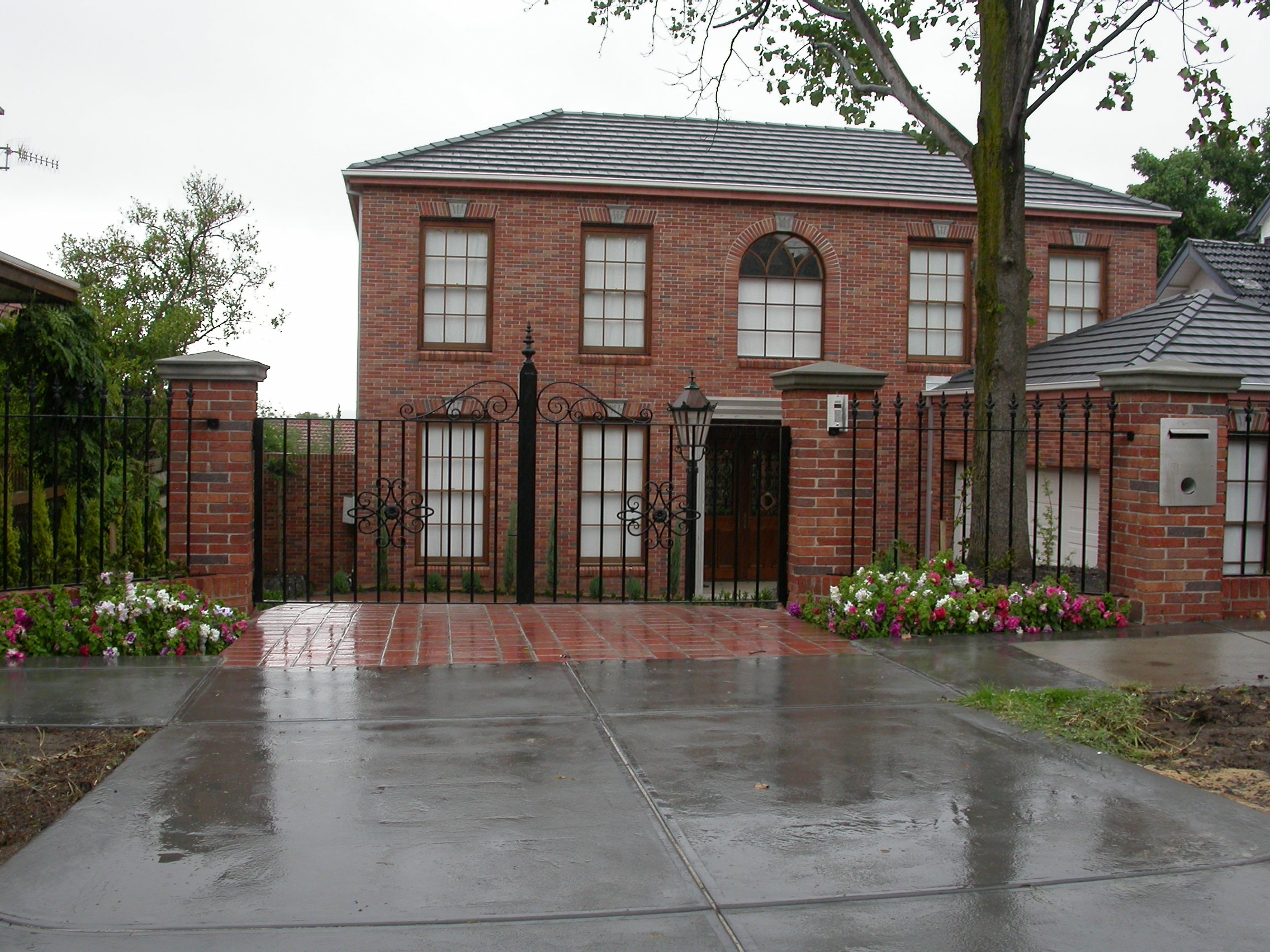 Black security fencing and pedestrian gate